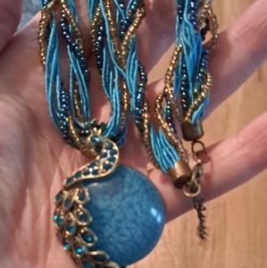 Beaded/satin rope multi string necklace with peacock pendant